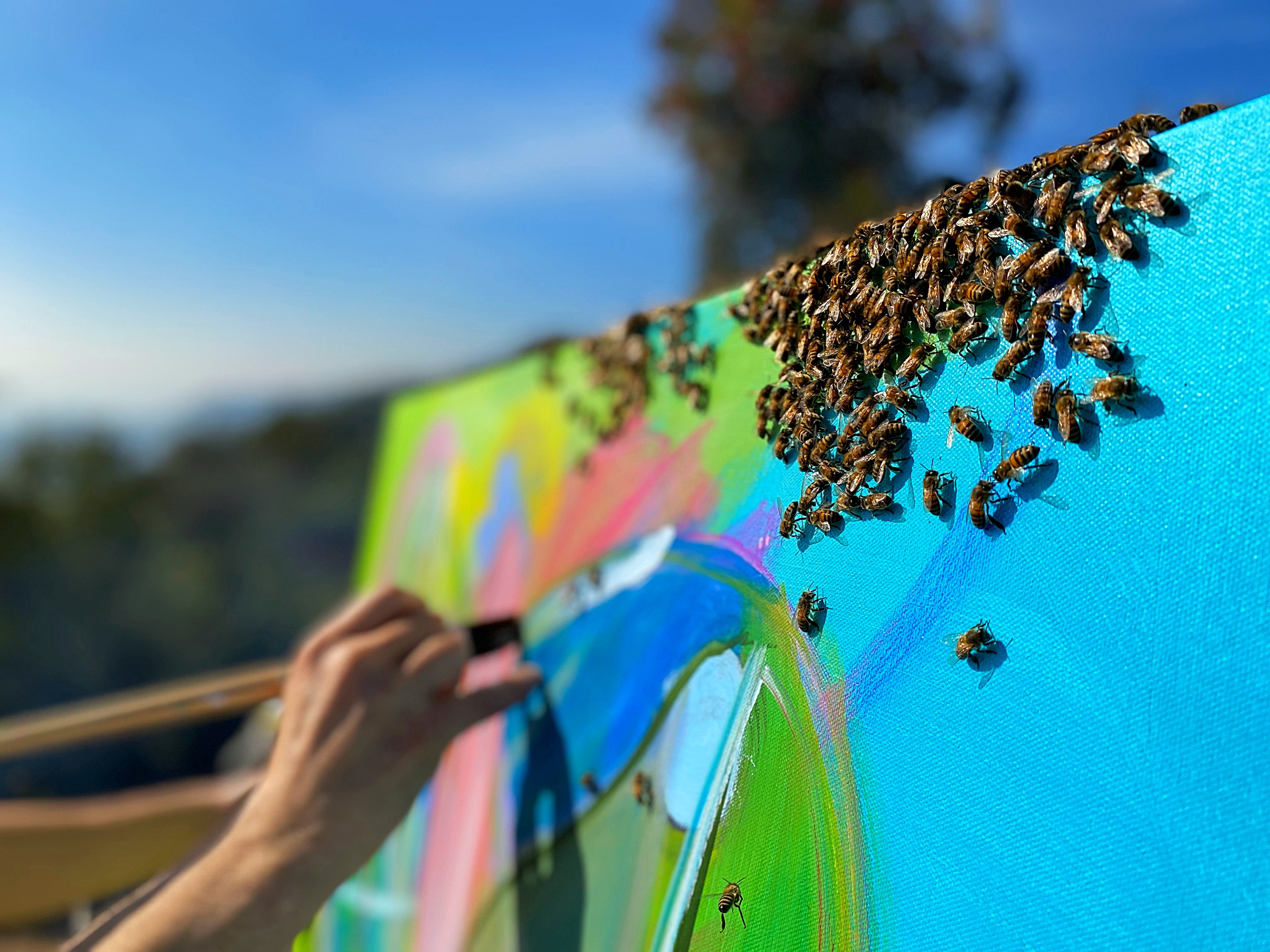 Steve Downs painting with bees during a live art demonstration